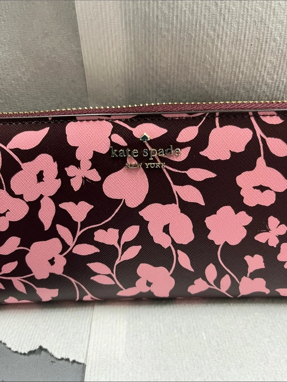 NWOT Kate Spade pink floral on dark maroon zip-around wallet